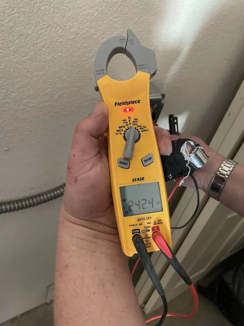 Voltage testing with clamp meter during Outlet Installation in Antelope